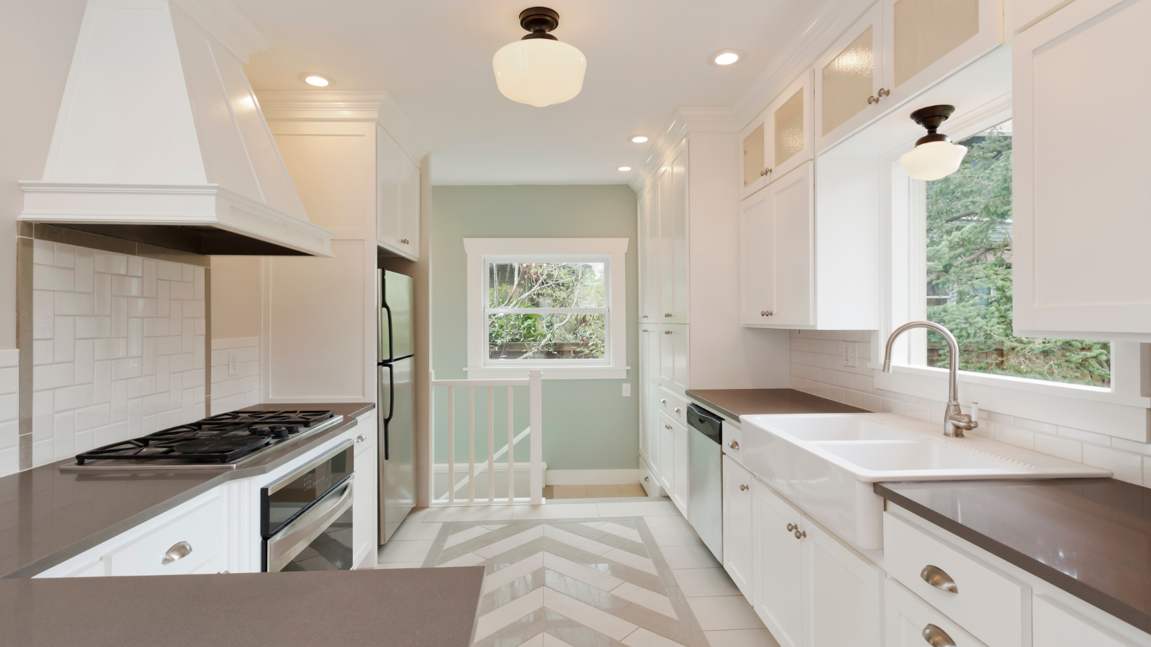 A kitchen with a stove top oven next to a sink