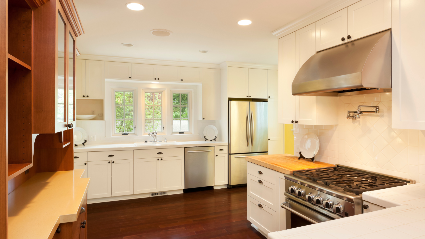 A kitchen with a stove top oven next to a refrigerator